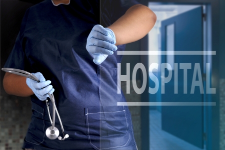 Doctor opening the hospital doorの写真素材