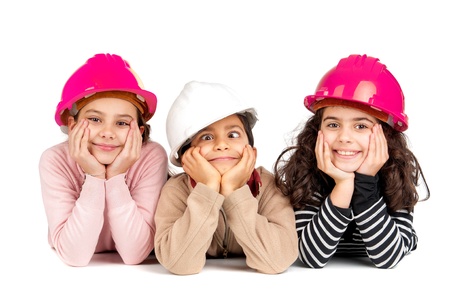 Group of children posing with protective helmets isolated in whiteの写真素材