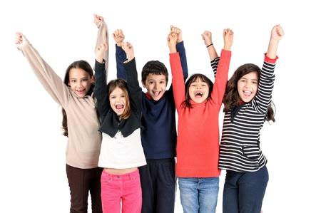Group of happy children posing isolated in whiteの写真素材