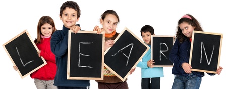 Group of children with black boards making the word   Learn isolated in whiteの写真素材