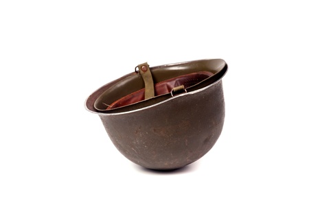 Old soldiers helmet isolated in whiteの写真素材