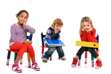 Young students seated in a chair isolated in whiteの写真素材