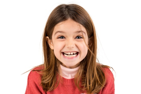 Funny young girl making faces isolated in white background