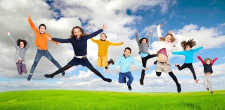 Group of children jumpng outdoorsの写真素材
