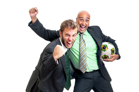 Happy businessmen with soccer ball isolated in whiteの写真素材