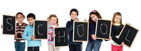 Group of children with black boards making the ord "School" isolated in whiteの写真素材