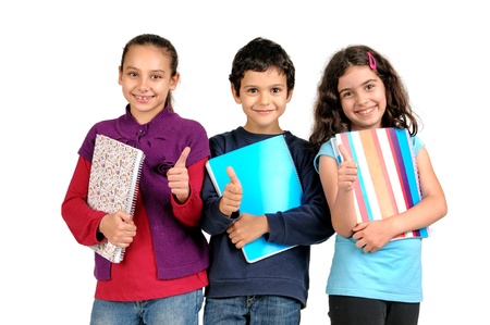Group of children posing with books isolated in whiteの写真素材