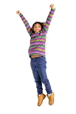 Young girl jumping isolated in whiteの写真素材