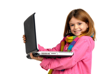 Young girl posing with laptop isolated in whiteの写真素材