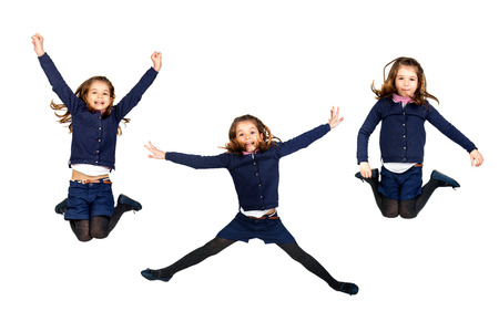 Young girl jumping isolated in whiteの写真素材