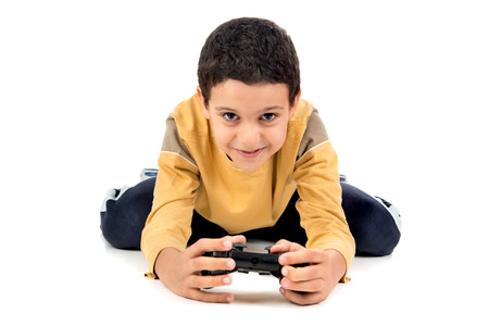 Boy playing video games isolated in white