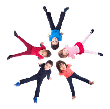 Group of children making a star posing isolated in whiteの写真素材