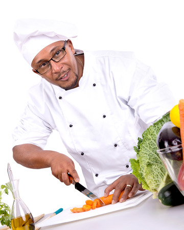 Male chef with fruits and vegetables cookingの写真素材