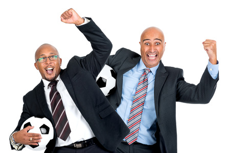 Businessmen with soccer ball isolated in whiteの写真素材