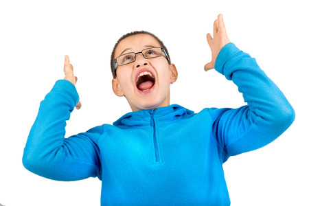 Young boy screaming isolated in whiteの写真素材