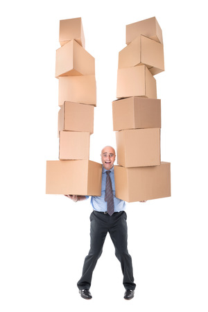 Businessman carrying piles of cardboard boxesの写真素材