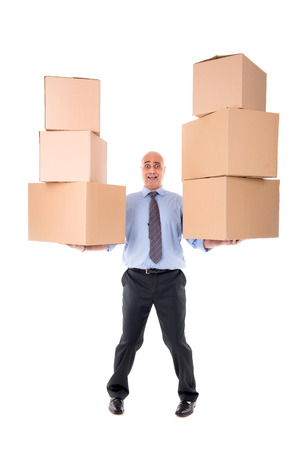 Businessman carrying piles of cardboard boxesの写真素材