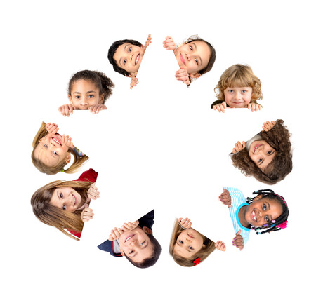 Group of children with a star shaped white board isolated in whiteの写真素材