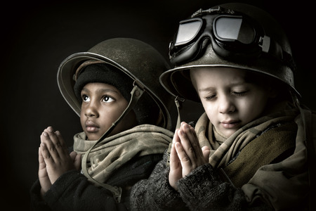 Young boy soldiers praying