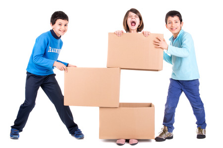 Kids playing with cardboard boxesの写真素材