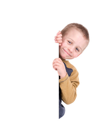 Young boy posing with a white boardの写真素材