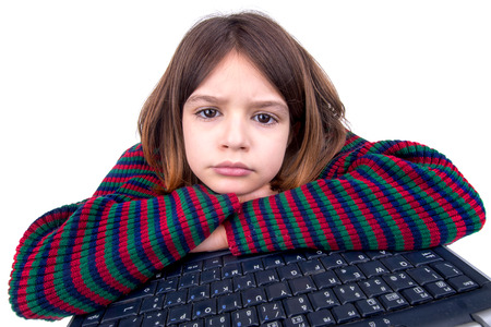 Desperate young girl with laptop computerの写真素材