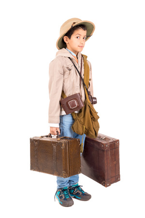 Young boy with suitcases playing Safari isolated in whiteの写真素材