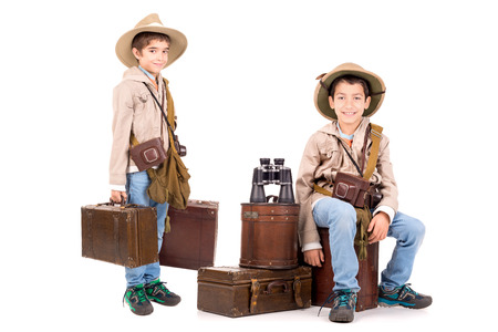 Young boys with suitcases playing Safari isolated in whiteの写真素材