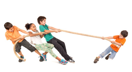 Group of children in a rope-pulling contest against just one kidの写真素材