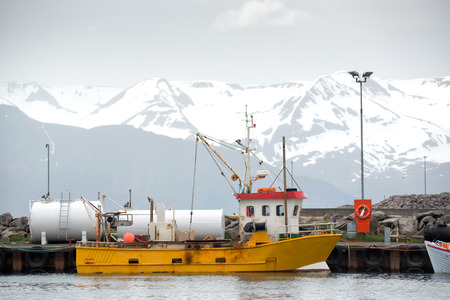 Fishing boat in Husavik harbor in Icelandのeditorial素材