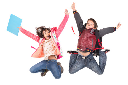 Young students couple  jumping isolated in whiteの写真素材