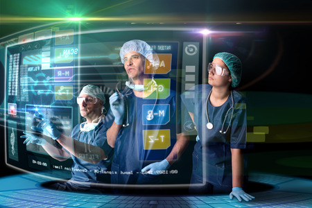 Doctors in a research station with digital  screens and keyboardの写真素材