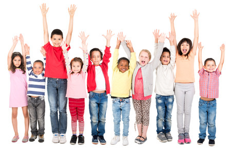 Group of children posing with raised hands isolated in whiteの写真素材