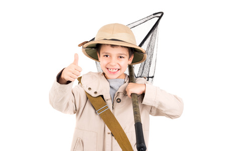 Young boy with net playing Safari isolated in whiteの写真素材