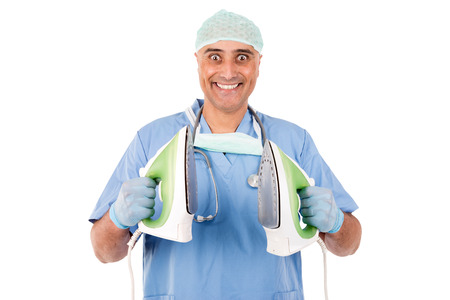 doctor with iron ready for defribillationの写真素材