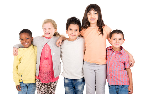 Group of happy children posing isolated in whiteの写真素材