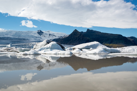 Reflections in Fjallsarlon lagoon, Iceland in Juneの写真素材