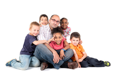 Group of children with teacher isolated in whiteの写真素材