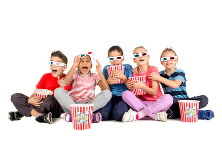 Group of children with 3d glasses and popcornの写真素材