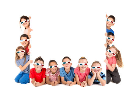 Group of children with 3d glasses over a white board