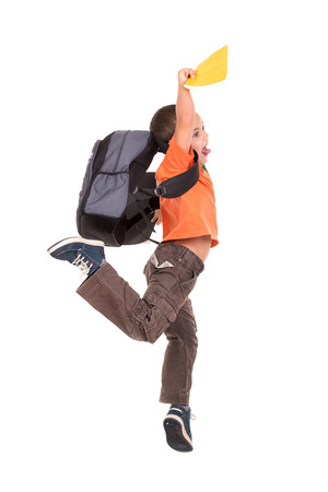 Young boy student jumping isolated in whiteの写真素材