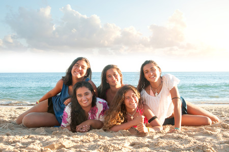 Group of happy teen girls at the beachの写真素材