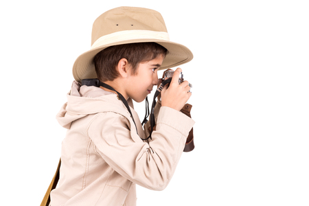 Young boy with camera playing Safari isolated in whiteの写真素材