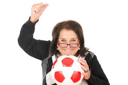 Beautiful senior woman with soccer ball isolated in whiteの写真素材