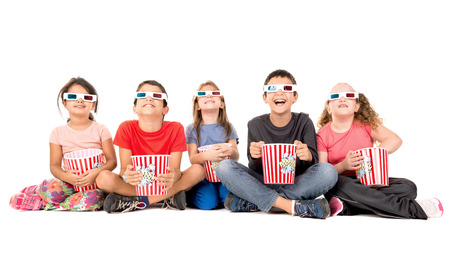 Group of children with 3d glasses and popcornの写真素材