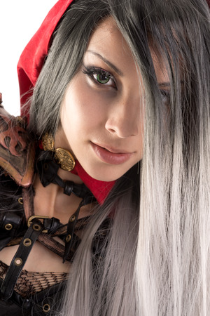 Girl in a dark Red riding hood costume isolated in whiteの写真素材