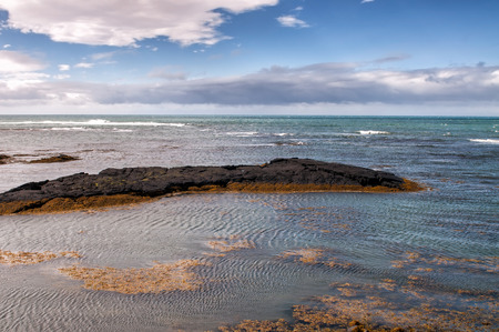 View of north Atlantic from an icelandic shoreの写真素材