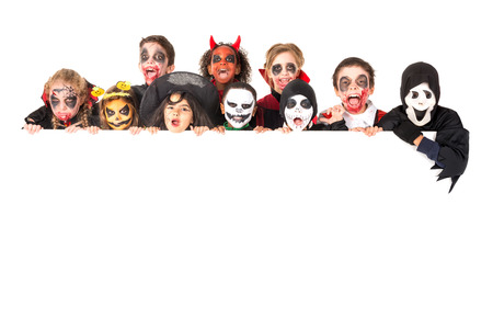 Group of kids with face-paint and Halloween costumes