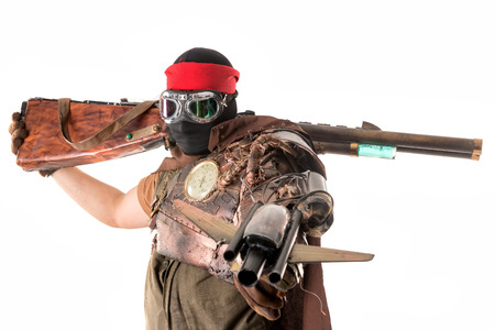 Futuristic soldier posing with gun and armor isolated in whiteの写真素材