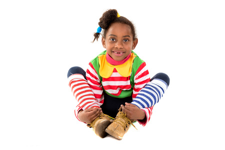 Young girl with clown costume isolated in whiteの写真素材